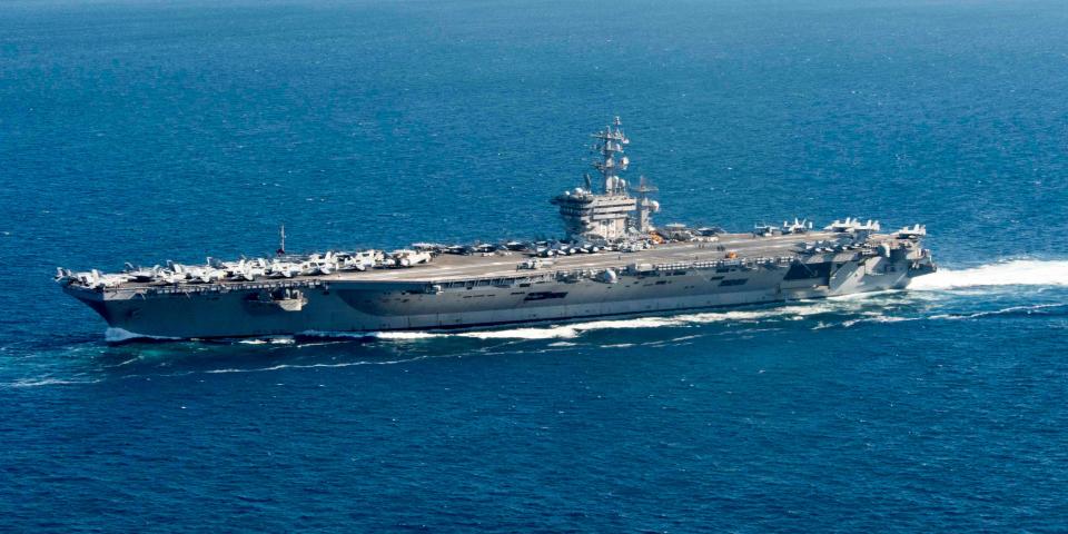A large aircraft carrier at sea.