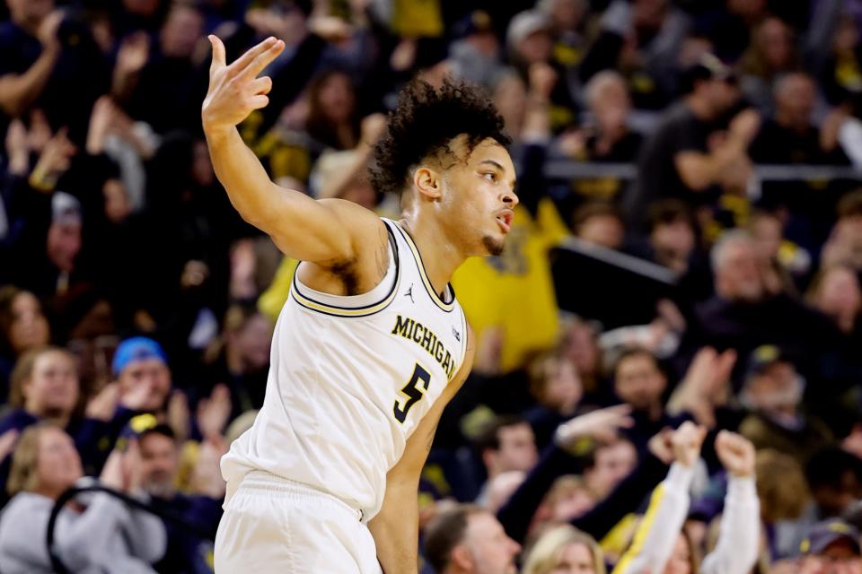 Dec 29, 2023; Ann Arbor, Michigan, USA; Michigan Wolverines forward Terrance Williams II (5) celebrates a three point basket in the first half against the McNeese State Cowboys at Crisler Center. Mandatory Credit: Rick Osentoski-USA TODAY Sports