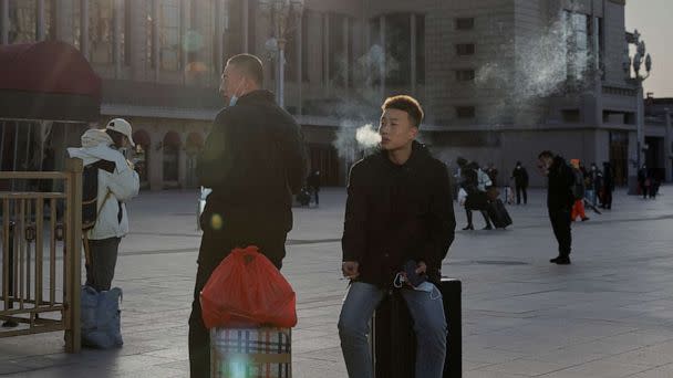 PHOTO: People wait outside Beijing Railway Station as they travel for Spring Festival ahead of Chinese Lunar New Year festivities in Beijing, China, on Jan. 16, 2023. (Thomas Peter/Reuters)