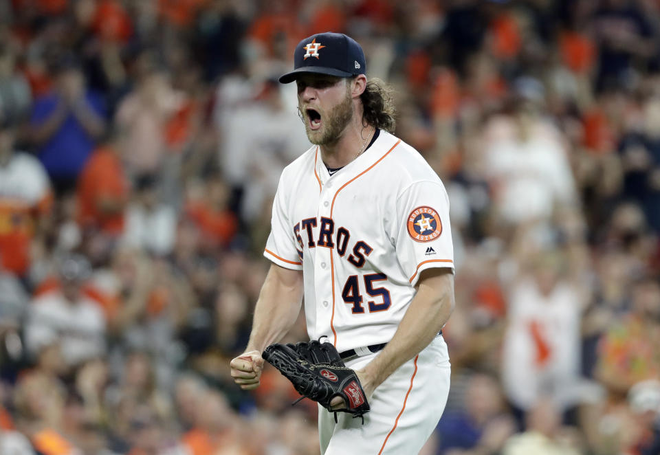 Houston Astros starting pitcher Gerrit Cole (45) reacts after striking out Cleveland Indians' Jose Ramirez to end the sixth inning of Game 2 of a baseball American League Division Series, Saturday, Oct. 6, 2018, in Houston. (AP Photo/David J. Phillip)
