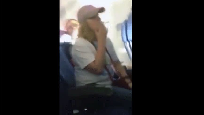 A woman has been caught smoking on a flight. Photo: Youtube