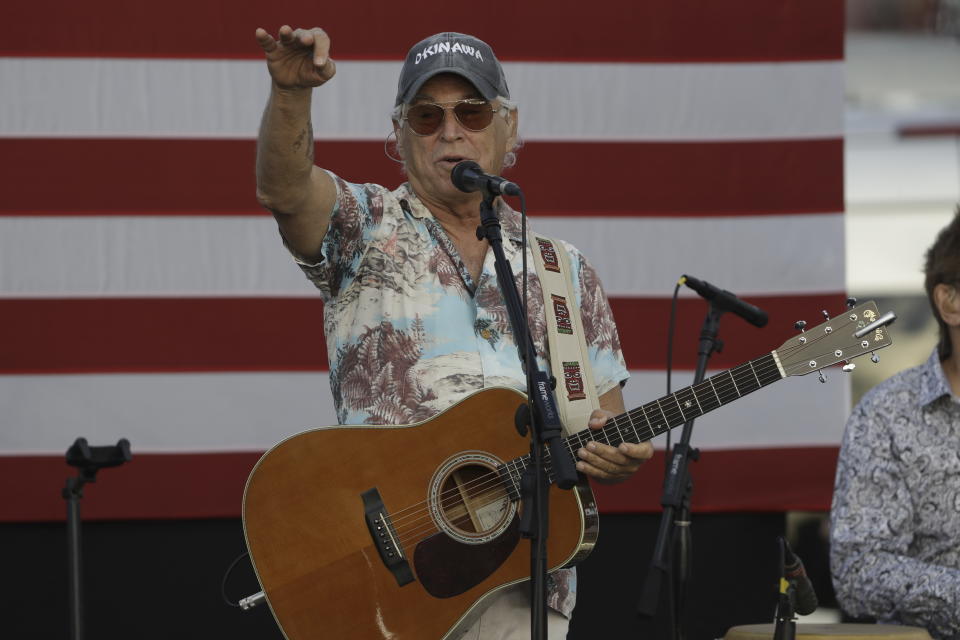 FILE - Singer Jimmy Buffett during a "Get Out To Vote" speech for Democratic presidential candidate Hillary Clinton Monday Nov. 7, 2016, in St. Petersburg, Fla. Buffett, who popularized beach bum soft rock with the escapist Caribbean-flavored song “Margaritaville” and turned that celebration of loafing into an empire of restaurants, resorts and frozen concoctions, has died, Friday, Sept. 1, 2023. (AP Photo/Chris O'Meara, File)