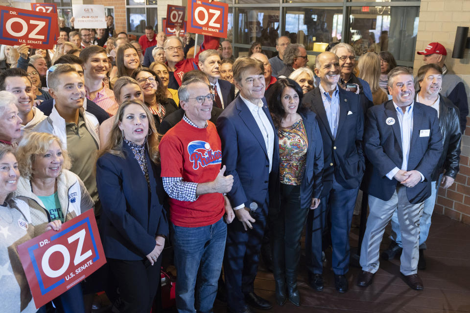 FILE - Supporters gather to hear Mehmet Oz, a Republican candidate for U.S. Senate in Pennsylvania, center with Ronna McDaniel, RNC Chairwoman, left in blue, and Guy Ciarrocchi, PA-06 Republican nominee, speak during a campaign event in Malvern, Pa., Saturday, Oct. 15, 2022. (AP Photo/Laurence Kesterson, File)