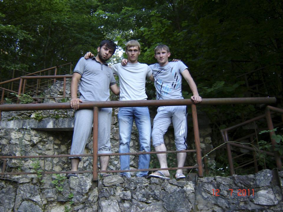 (L-R) Minkail Temiev, Viktor Zyzin and Magomed Khasiev, pose for a picture in a park in the southern city of Maykop, Russia in this handout photo provided to Reuters by Viktor Zyzin. To match insight RUSSIA-SYRIA/SPY REUTERS/Viktor Zyzin/Handout via ReutersATTENTION EDITORS - THIS PICTURE WAS PROVIDED BY A THIRD PARTY. REUTERS IS UNABLE TO INDEPENDENTLY VERIFY THE AUTHENTICITY, CONTENT, LOCATION OR DATE OF THIS IMAGE. THIS PICTURE IS DISTRIBUTED EXACTLY AS RECEIVED BY REUTERS, AS A SERVICE TO CLIENTS. FOR EDITORIAL USE ONLY. NOT FOR SALE FOR MARKETING OR ADVERTISING CAMPAIGNS. FOR EDITORIAL USE ONLY. NO RESALES. NO ARCHIVE.