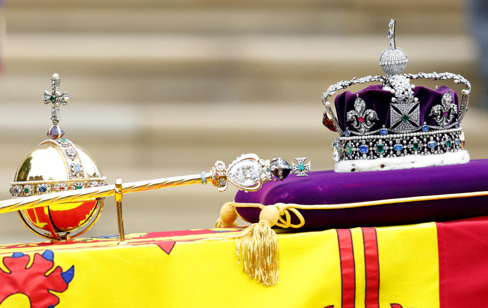 WINDSOR, UNITED KINGDOM - SEPTEMBER 19: (EMBARGOED FOR PUBLICATION IN UK NEWSPAPERS UNTIL 24 HOURS AFTER CREATE DATE AND TIME) The Sovereign's Orb, Sceptre and The Imperial State Crown sit on top of Queen Elizabeth II's Royal Standard draped coffin at her Committal Service at St George's Chapel, Windsor Castle on September 19, 2022 in Windsor, England. The committal service at St George's Chapel, Windsor Castle, took place following the state funeral at Westminster Abbey. A private burial in The King George VI Memorial Chapel followed. Queen Elizabeth II died at Balmoral Castle in Scotland on September 8, 2022, and is succeeded by her eldest son, King Charles III. (Photo by Max Mumby/Indigo/Getty Images)