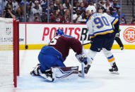 St. Louis Blues center Ryan O'Reilly (90) scores a goal against Colorado Avalanche goaltender Darcy Kuemper (35) during the first period in Game 1 of an NHL hockey Stanley Cup second-round playoff series Tuesday, May 17, 2022, in Denver. (AP Photo/Jack Dempsey)