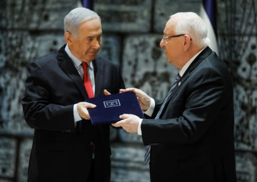 Israeli President Reuven Rivlin minister (R) has appointed outgoing prime minister Benjamin Netanyahu to head the next government