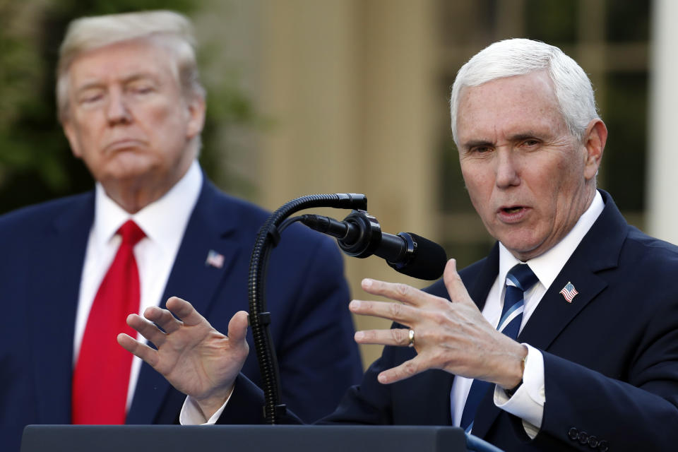 FILE - President Donald Trump listens as Vice President Mike Pence speaks about the coronavirus in the Rose Garden of the White House, April 27, 2020, in Washington. As Mike Pence approaches a likely 2024 run for president, he's opening up to audiences about the parts of his career before he served as Donald Trump's vice president. He hopes his 12 years in Congress and four years as Indiana governor will project the record of a conservative fighter. (AP Photo/Alex Brandon, File)