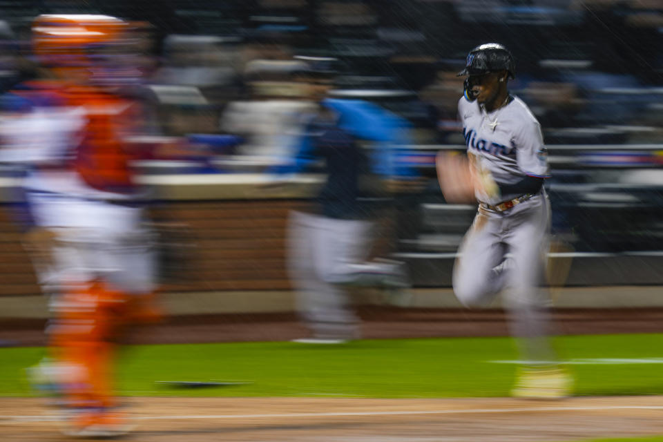 Miami Marlins' Jazz Chisholm Jr. runs toward home plate to score on a Yuli Gurriel single during the ninth inning of a baseball game against the New York Mets, Thursday, Sept. 28, 2023, in New York. (AP Photo/Frank Franklin II)