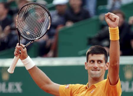 Novak Djokovic of Serbia reacts after defeating Tomas Berdych of the Czech Republic during their men's singles tennis match final at the Monte Carlo Masters in Monaco April 19, 2015. REUTERS/Jean-Paul Pelissier