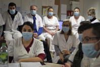 Ward's chief psychiatrist, Sandrine Elias, center right, attends a team meeting with medical staff at the emergency ward of the Rouvray psychiatric hospital, in Rouen, western France, Wednesday, Nov. 25, 2020. Lockdowns that France has used to fight the coronavirus have come at considerable cost to mental health. Surveying points to a surge of depression most acute among people without work, in financial hardship and young adults. (AP Photo/Thibault Camus)