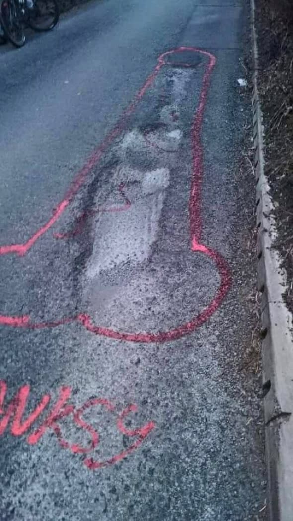 Crusader draws giant penises around Britain's potholes