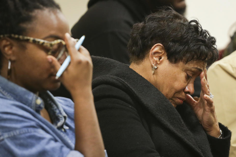 CORRECTS DATE Family members of victims in the Topps supermarket shooting react as Erie County District Attorney John Flynn reads the names of victims during a press conference at Erie County Court, in Buffalo, N.Y., Monday, Nov. 28, 2022. (AP Photo/Joshua Bessex)