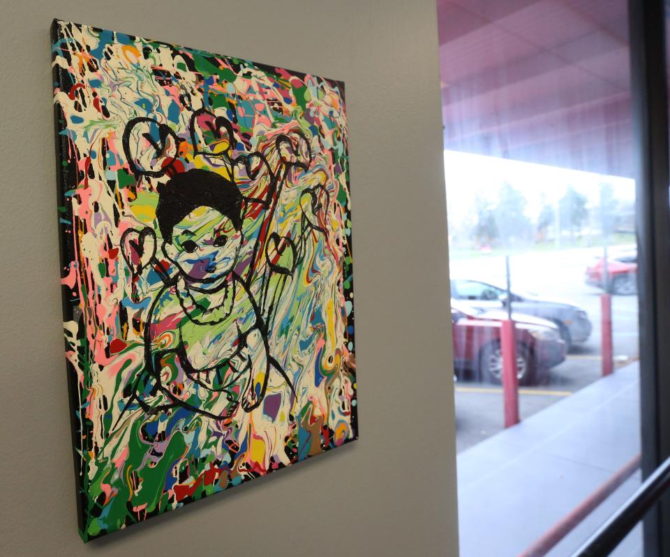 Artwork by youths adorns rooms and hallways at La Casa de Amistad on South Michigan Street in South Bend.