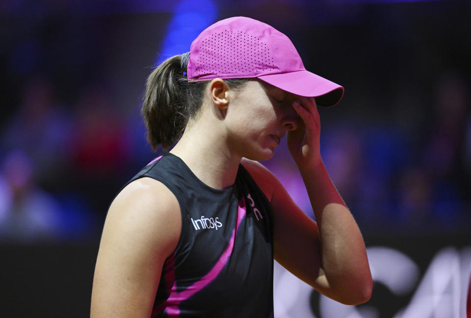 Poland's Iga Swiatek reacts during her semifinal match of the WTA Tour against Kazakhstan's Elena Rybakina, in Stuttgart, Germany, Saturday April 20, 2024. (Marijan Murat/dpa via AP)