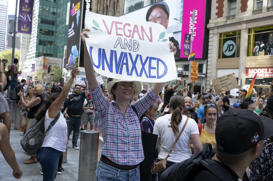 <span class="caption">Several thousand protestors opposed to the COVID-19 vaccine march through the streets of midtown Manhattan in New York on Sept. 18, 2021. </span> <span class="attribution"><a class="link " href="https://www.gettyimages.com/detail/news-photo/several-thousand-protestors-opposed-to-the-covid-19-vaccine-news-photo/1341164693?adppopup=true" rel="nofollow noopener" target="_blank" data-ylk="slk:Andrew Lichtenstein/Corbis News via Getty Images;elm:context_link;itc:0;sec:content-canvas">Andrew Lichtenstein/Corbis News via Getty Images</a></span>