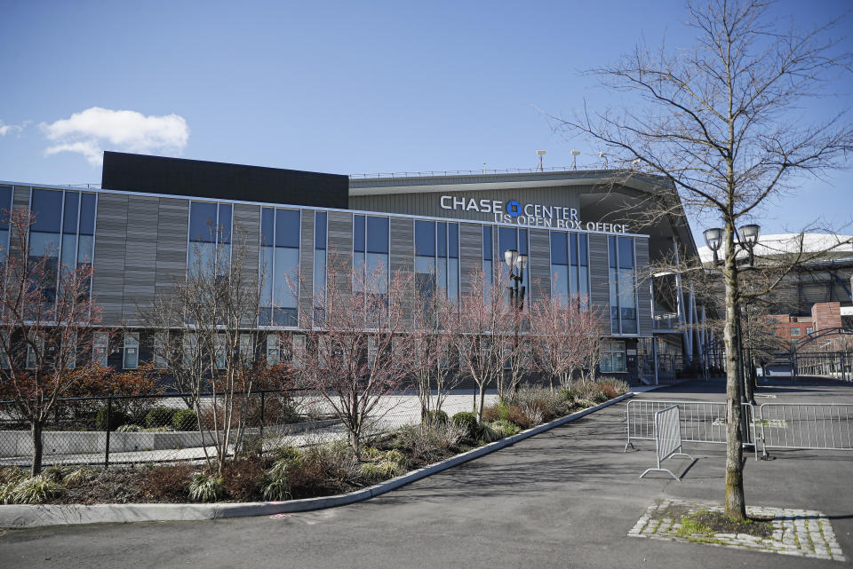 Barricades rest outside the Chase Center that will become a makeshift hospital, Wednesday, April 1, 2020, at the USTA Billie Jean King National Tennis Center in the Queens borough of New York. The new coronavirus causes mild or moderate symptoms for most people, but for some, especially older adults and people with existing health problems, it can cause more severe illness or death. (AP Photo/John Minchillo)