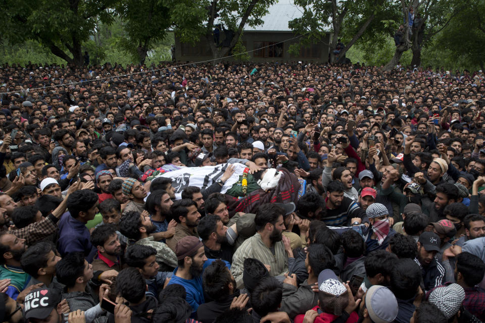 Kashmiri villagers carry body of top rebel commander Naseer Pandith, during his funeral procession in Pulwama, south of Srinagar, Indian controlled Kashmir, Thursday, May 16, 2019. Three rebels, an army soldier and a civilian were killed early Thursday during a gunbattle in disputed Kashmir that triggered anti-India protests and clashes, officials and residents said. (AP Photo/ Dar Yasin)