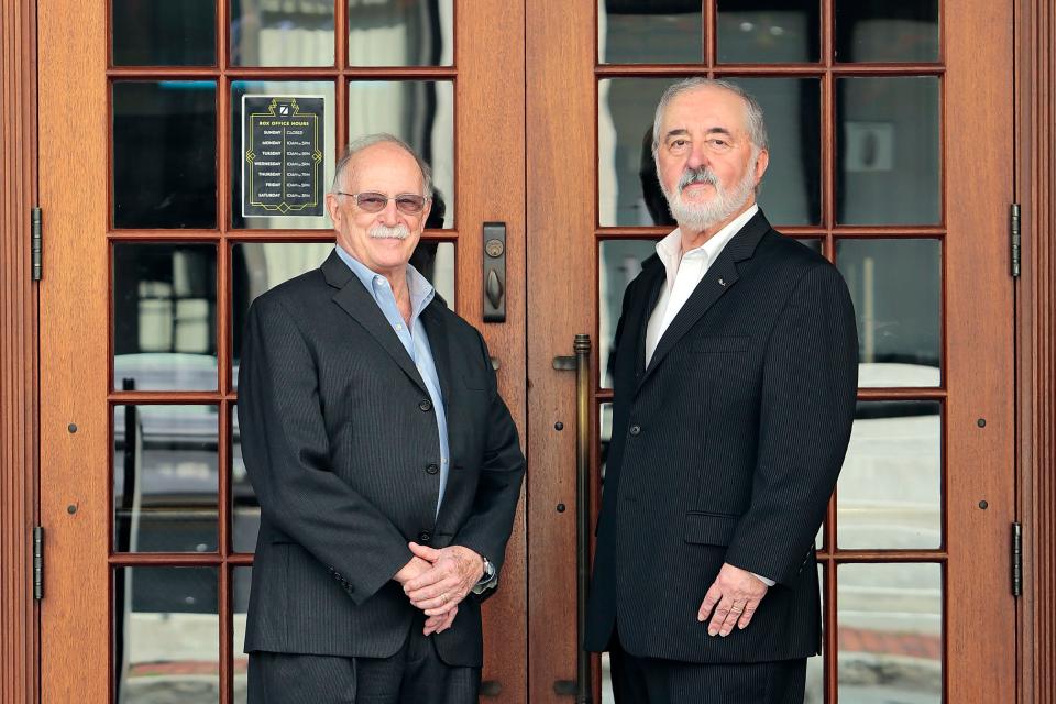 New Bedford Festival Theater Executive Producer, Armand Marchand, right, and Artistic Director George Charboneau, in front of the doors to the Zeiterion Theater in New Bedford.