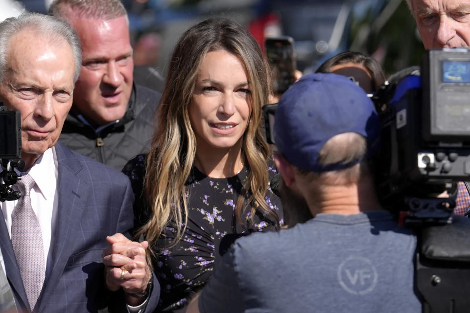 Karen Read, center, arrives at Norfolk Superior Court with her father William Read, left, Tuesday, June 25, 2024, in Dedham, Mass. Karen Read is on trial, accused of killing her boyfriend Boston police Officer John O'Keefe, in 2022. (AP Photo/Steven Senne)