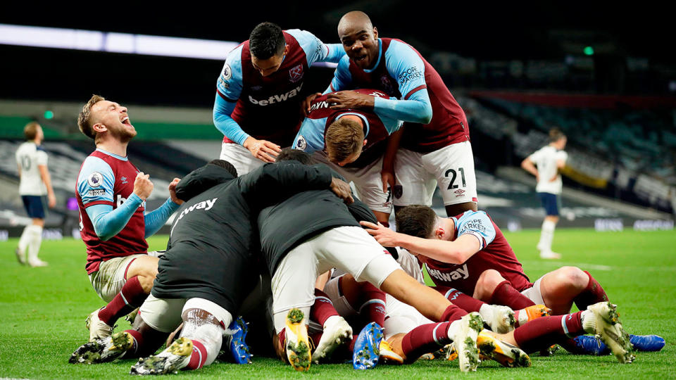 Seen here, West Ham's players celebrate their late equaliser against Spurs.