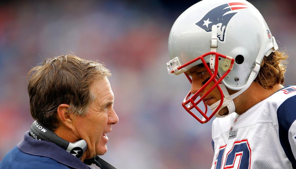Bill Belichick talks with Tom Brady at the tail end of a game in Foxborough, Massachusetts,&nbsp;in 2010. (Photo: Adam Hunger / Reuters)