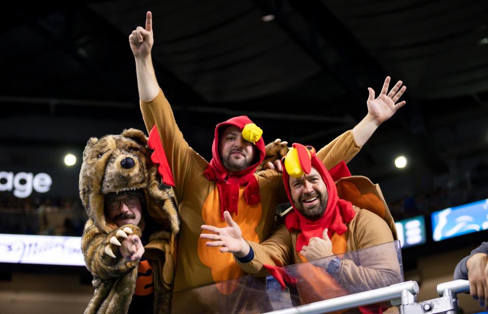 Fans wear Thanksgiving outfits during the game between the Detroit Lions and Chicago Bears at Ford Field on Nov. 25, 2021.
