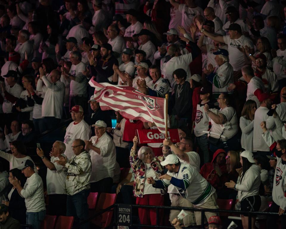 Utica Comets fans celebrate Alexander Holtz's goal against the Rochester Americans during the 2022 Calder Cup Playoffs on Thursday, May 19, 2022 at the Adirondack Bank Center in Utica. The Comets would go on to lose 4-2 and be eliminated from the playoffs.