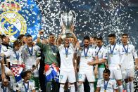 <p>Make mine a treble: Real Madrid win their third successive UEFA Champions League trophy</p>