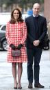 <p>For day two of the royal tour of Sweden, Kate wore a red-and-white houndstooth coat by Catherine Walker paired with brown gloves, a Chanel bag and earrings by Swedish designer In2Design</p>