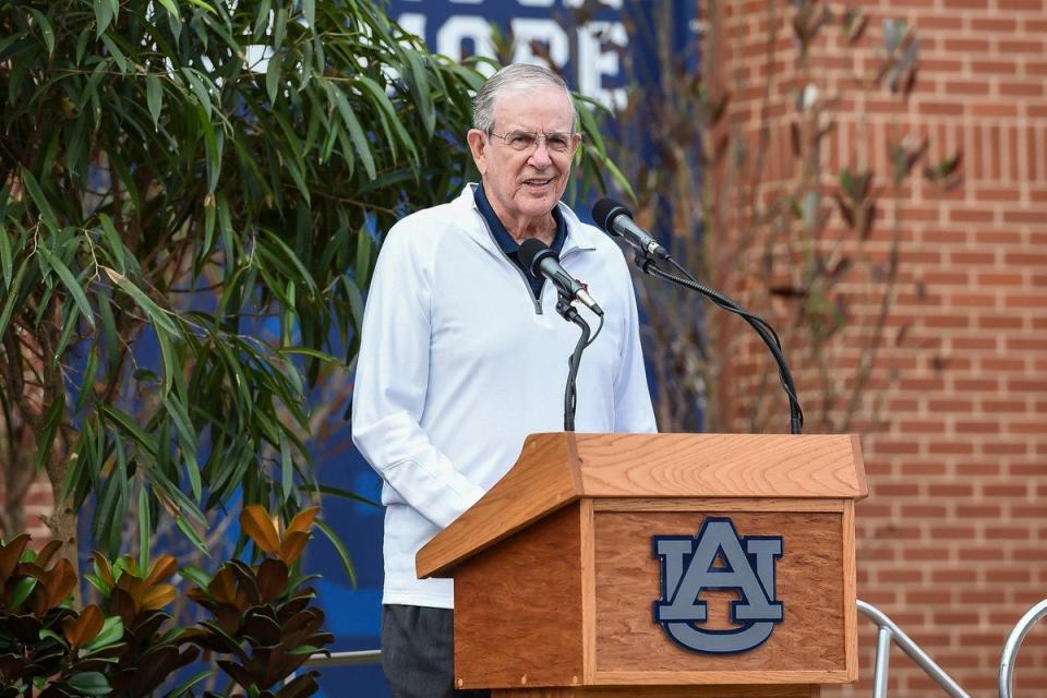 Former Auburn coach Sonny Smith speaks at the unveiling of the Charles Barkley statue at Auburn Arena.