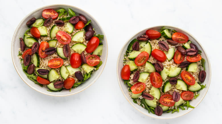 mediterranean salad and grains in bowls