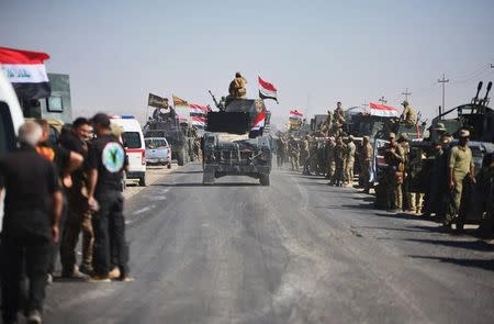 Members of Iraqi federal forces gather to continue to advance in military vehicles in Kirkuk, Iraq October 16, 2017. REUTERS/Stringer