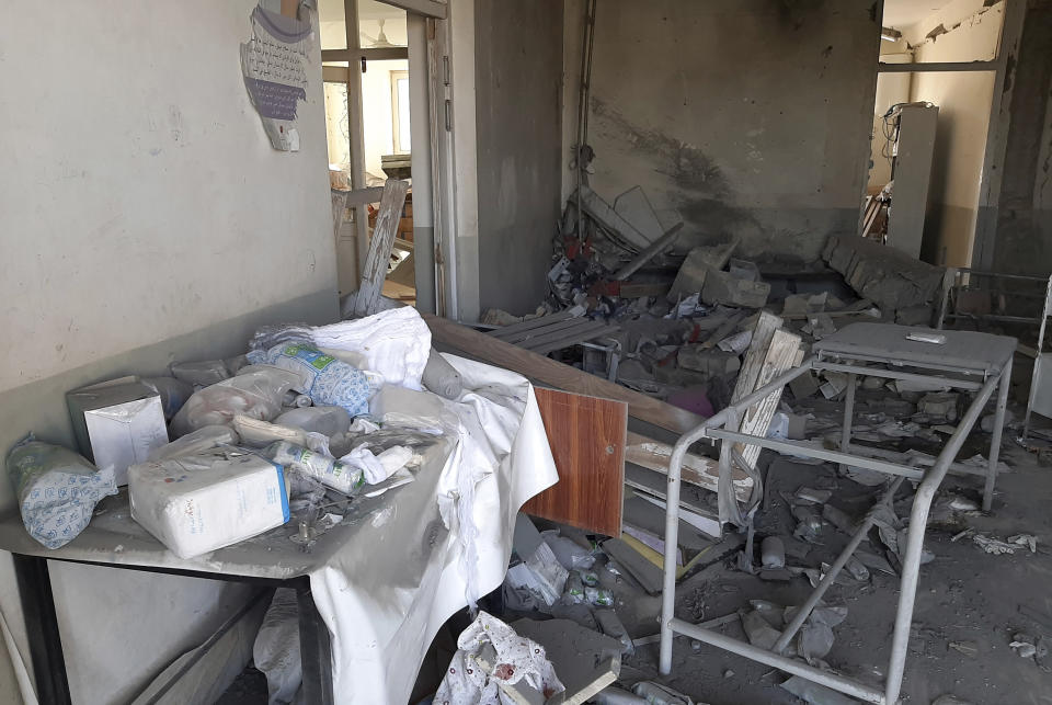 A damaged clinic is seen after airstrikes in Lashkar Gah city of Helmand province, south of Kabul, Afghanistan, Sunday, Aug. 8, 2021. Airstrikes in southern Afghanistan damaged a health care clinic and high school in the capital of Helmand province, a provincial council member said Sunday. (AP Photo/Abdul Khaliq)