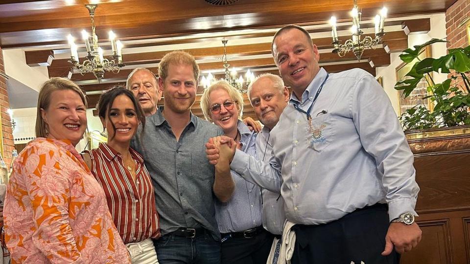 The Duke and Duchess pictured with the hotel owner and waiter who served them