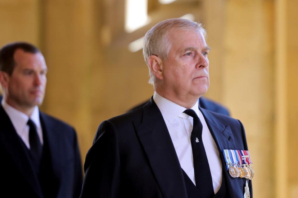 Prince Andrew wearing a dark suit and medals at Prince Philip's funeral in April 2021.