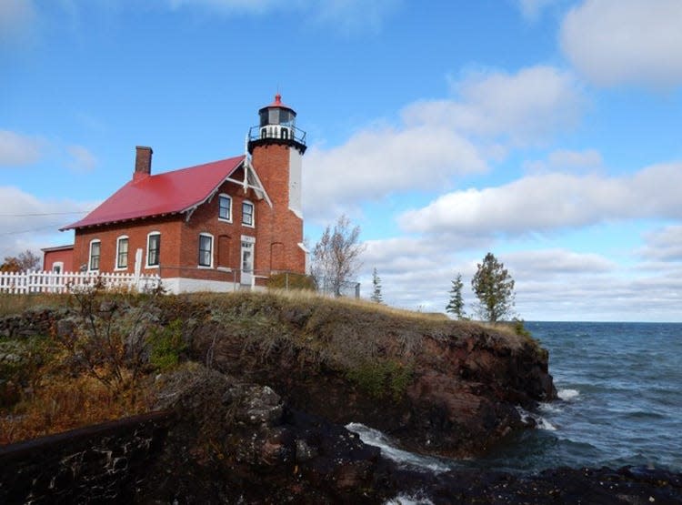 The Eagle Harbor Lighthouse is shown.