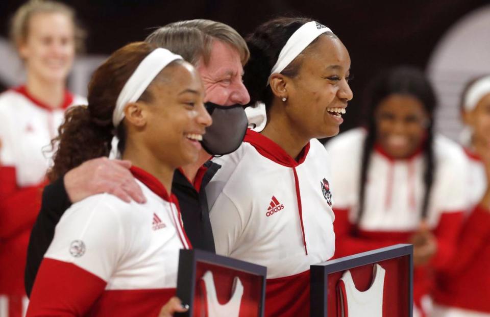 N.C. State head coach Wes Moore poses with seniors Kai Crutchfield, left, and Kayla Jones during senior day activities before N.C. State’s game against Pittsburgh at Reynolds Coliseum in Raleigh, N.C., Thursday, February 25, 2021.