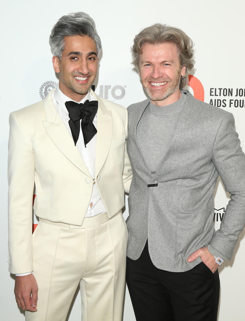 Tan France and Rob France pose at the Elton John AIDS Foundation Academy Awards Viewing Party in February 2020