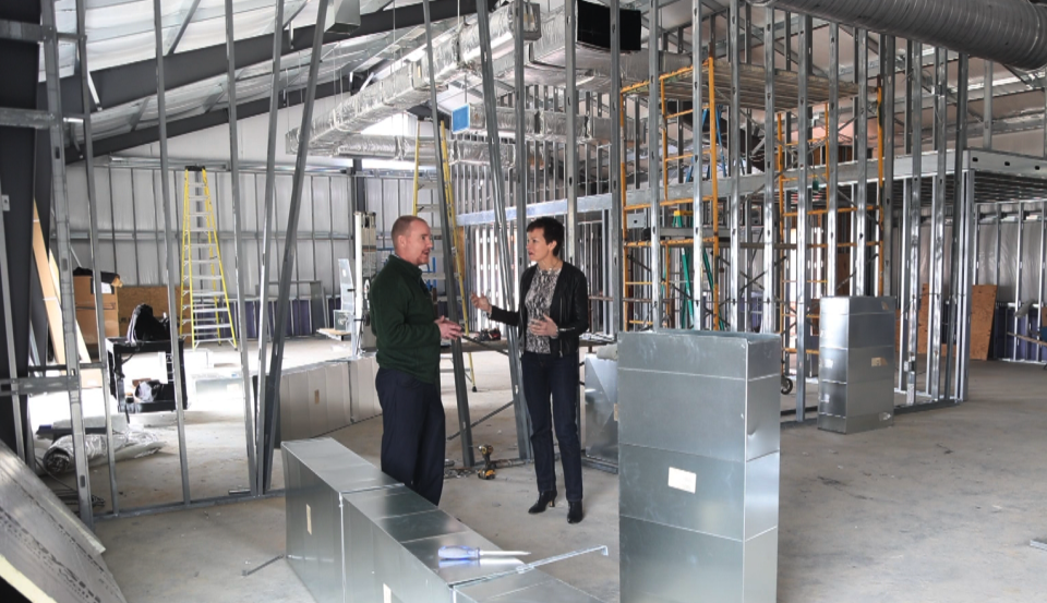 Northumberland High School Principal Travis Burns and correspondent Stephanie Gosk tour the school’s new multipurpose facility, which is still undergoing construction.  (NBC News)