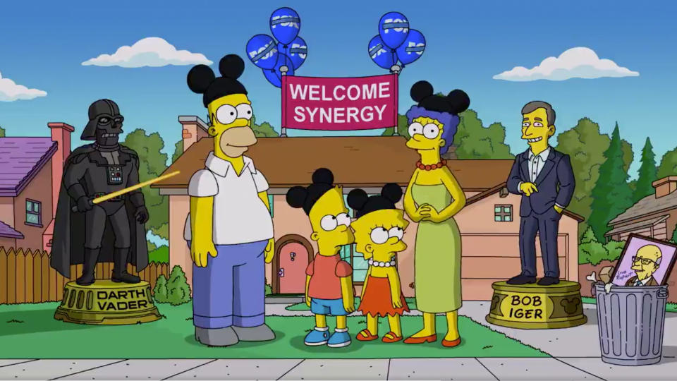 The Simpson family wear Mickey Mouse ears in a satire of the Disney Fox takeover.