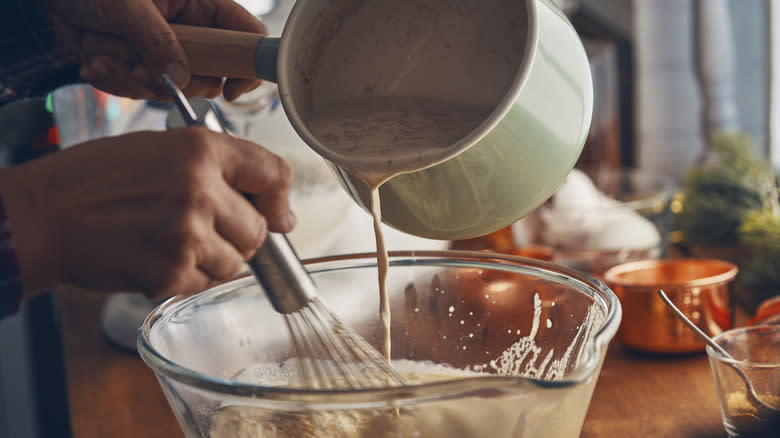 pouring eggnog in bowl