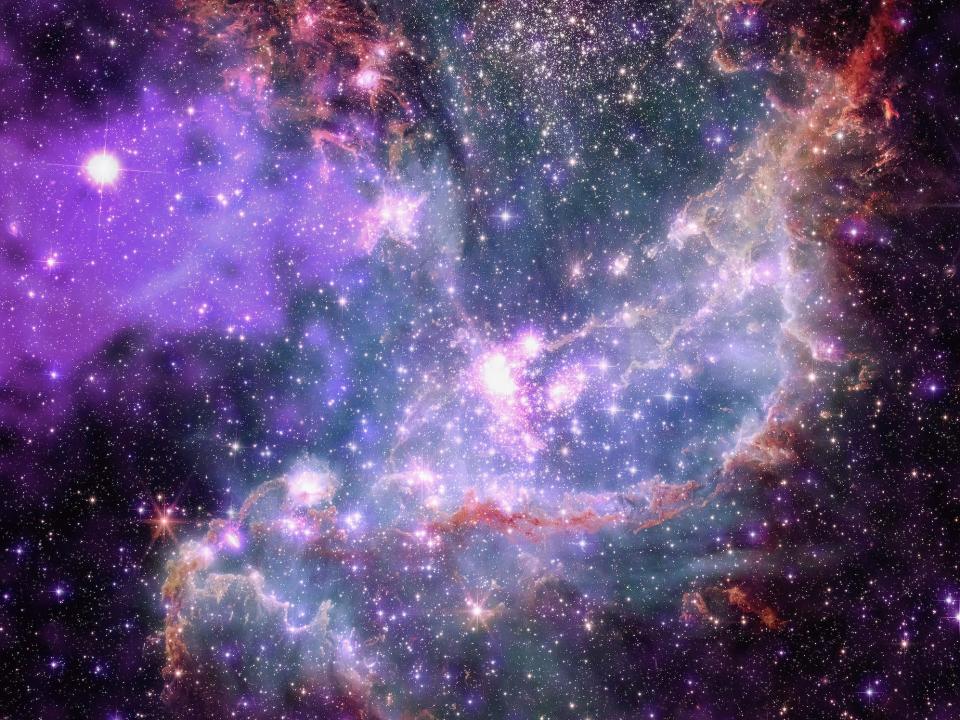 bright white stars in clouds of purple and pink dust beside a deep purple haze on the left against the blackness of space