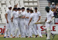 England cricket players celebrate the dismissal of South Africa's Hashim Amla (R) after he was dismissed by Steven Finn (2nd L) of England during the third cricket test match in Johannesburg, South Africa, January 14, 2016. REUTERS/Siphiwe Sibeko