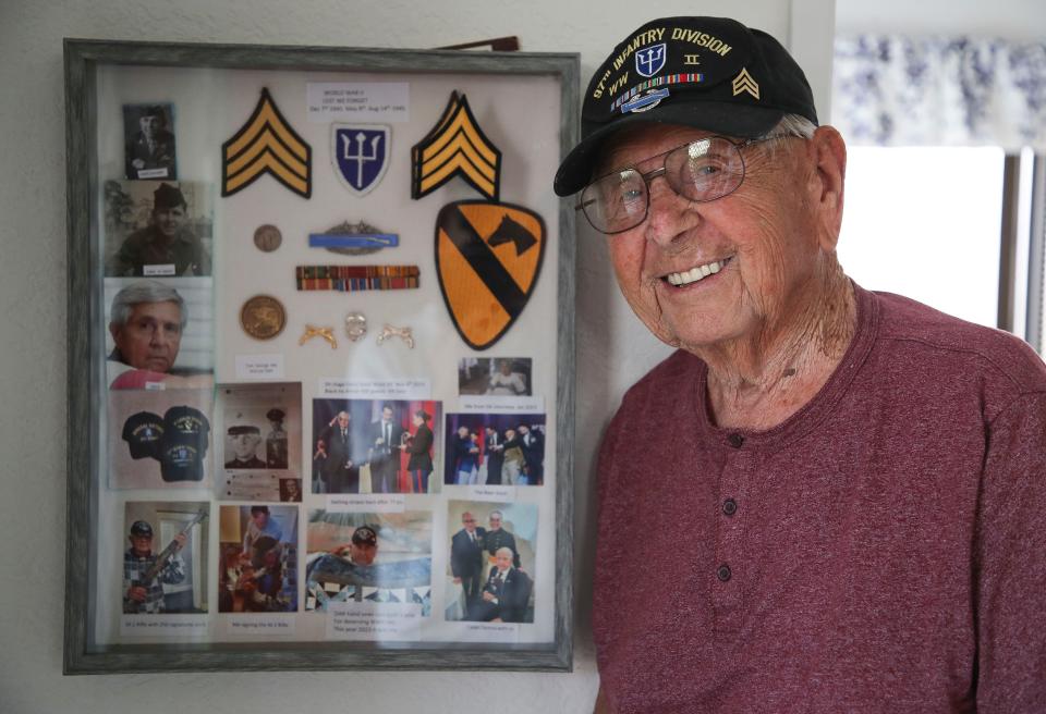 Robert Shipe with a shadow box of his mementoes from his service in the U.S. Army.