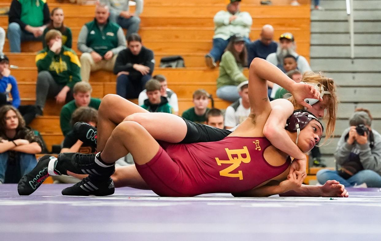 Bloomington South’s Amrin Pratt (back) wrestles against Bloomington North’s Trae Hopkins in the 132-pound third place match during the IHSAA wrestling regional at Bloomington South on Saturday, Feb. 3, 2024.