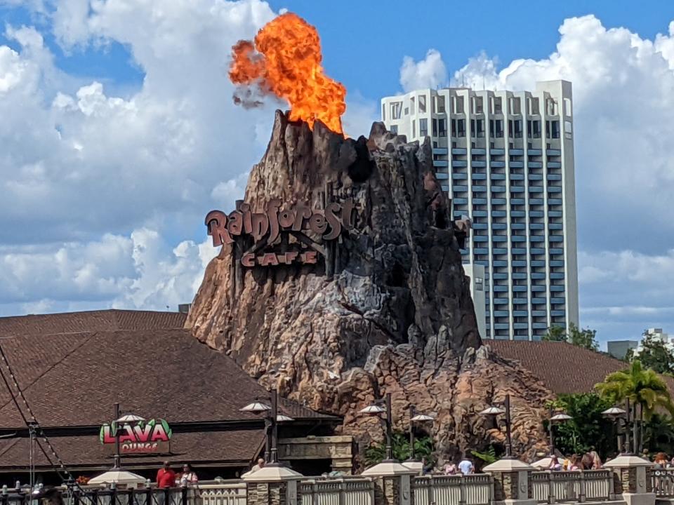 rainforest cafe volcano at disney springs erupting with fire 