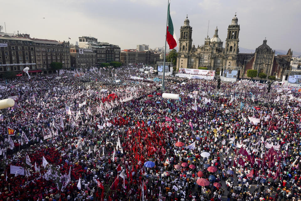 FILE - Supporters of the ruling party presidential candidate Claudia Sheinbaum fill the Zocalo during her opening campaign rally in Mexico City, March 1, 2024. Mexican voters will go to the polls in the largest elections in the country’s history on June 2, 2024. In the presidential race, they will have to choose between three candidates, but two women have taken the lead: Sheinbaum and opposition candidate Xóchitl Gálvez. (AP Photo/Aurea Del Rosario, File)