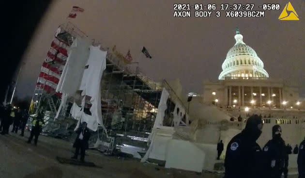 After Jeffrey Smith was hit by a metal object hurled by a member of the pro-Trump mob, a still from his body camera footage shows the inauguration platform outside the Capitol in tatters. (Photo: Metropolitan Police Department)