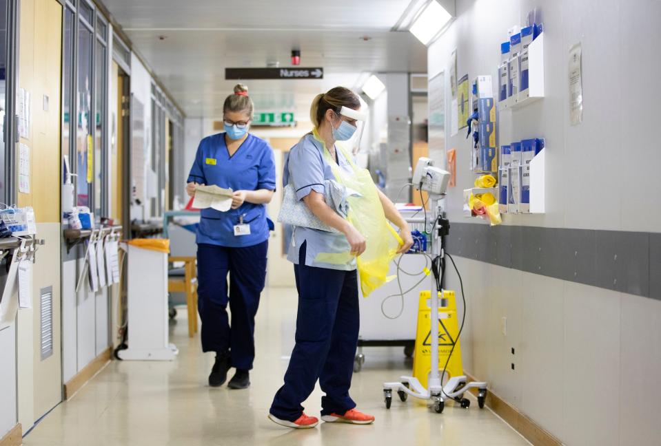 <p>Nurses working on Ward 5, a Covid red ward, at the Royal Alexandra Hospital in Paisley</p> (PA)